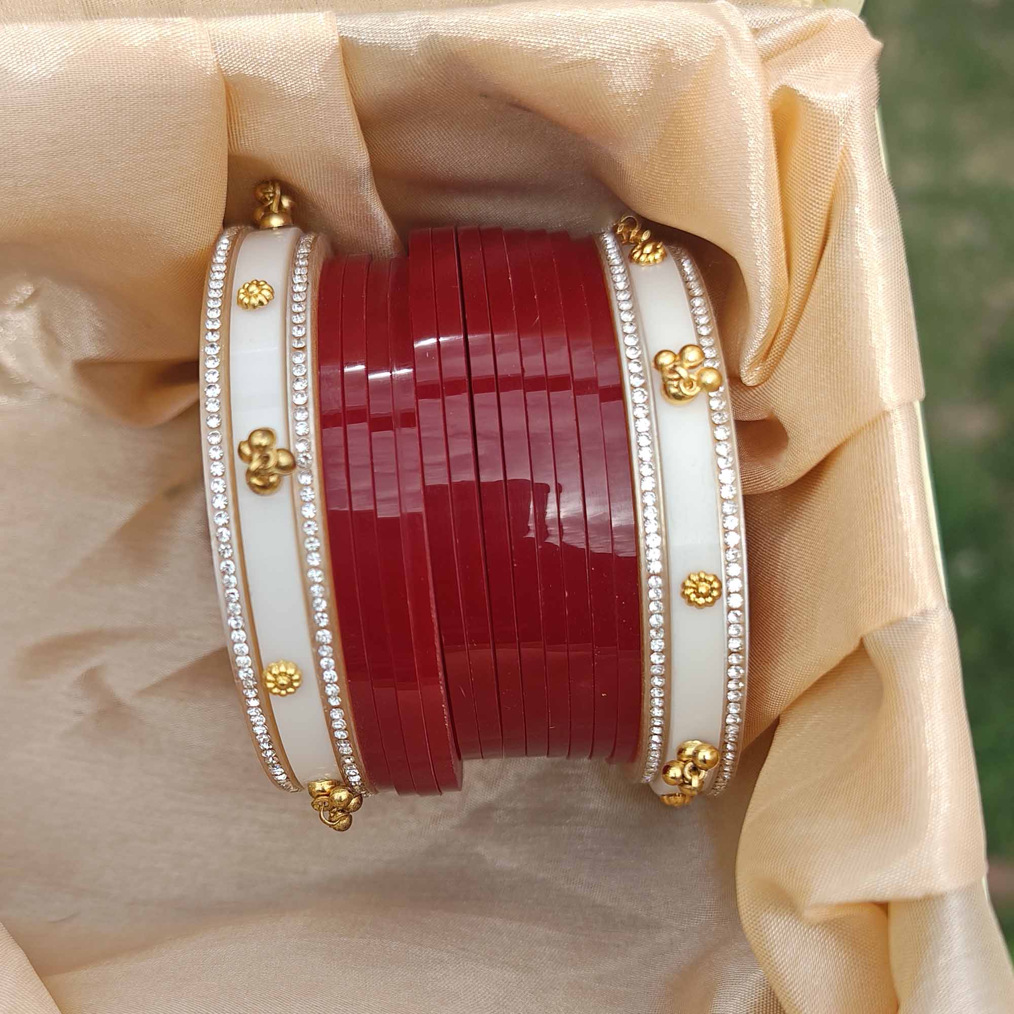 Red Bridal Chura Set with White Bangles, Gold Motifs & CZ Stone Detailing